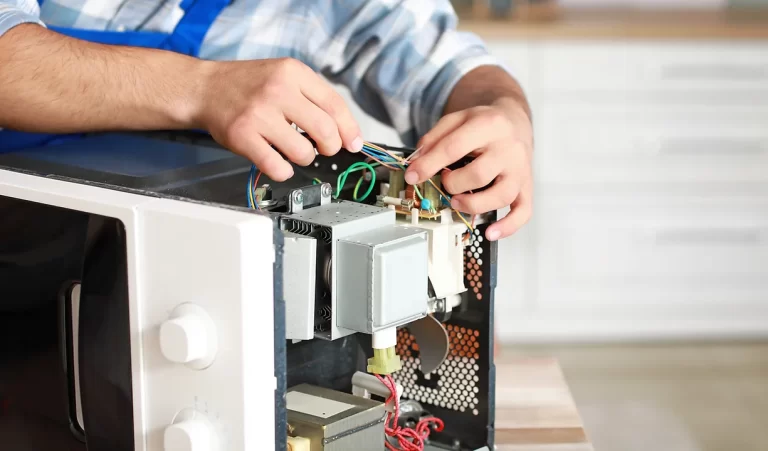 Worker repairing an appliance