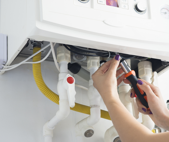 woman repairing appliance